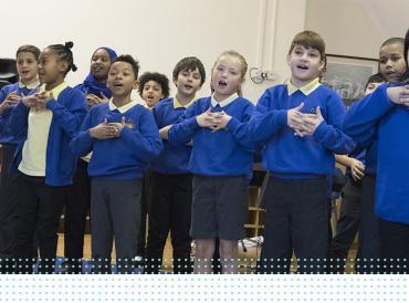 A group of LAMDA learners singing in rehearsal