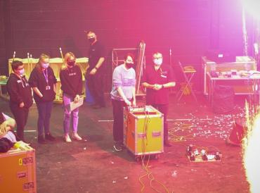 A production & technician arts student detonates a stage explosive during a pyrotechnics workshop in the Sainsbury Theatre