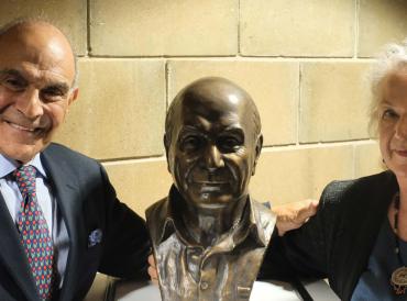 Photograph of Sir David Suchet CBE and Melbourne-based artist Julie Edgar stood with the sculpture at LAMDA 