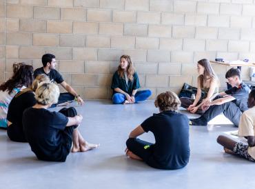 Students on a LAMDA short course sitting in a circle