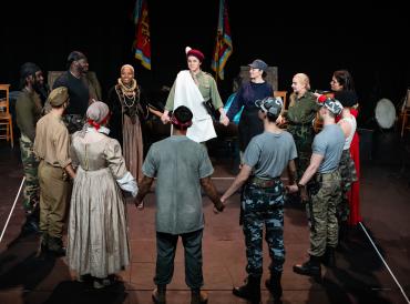 Photograph of MFA Professional Acting students in a production of Julius Caesar as part of the 2023 Shakespeare In Schools Tour