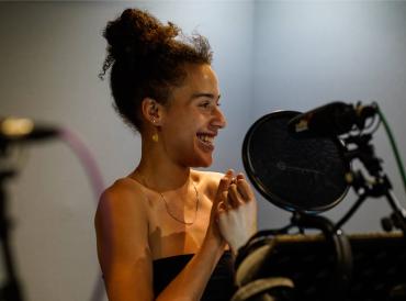 A student in a recording booth