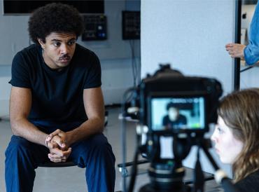 A short course participant acting in front of a camera
