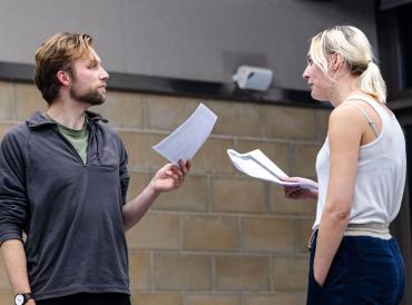 Two LAMDA Actor Refresh participants holding scripts