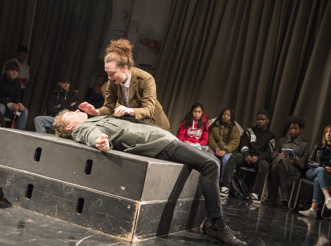 Two LAMDA students performing a scene from Julius Caesar in front of secondary school students