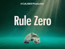 Graphic for Rule Zero with the wording 'A ColLAB22 Production - Rule Zero' on turquoise background with a sock with googly eyes on the ground towards the bottom of the image