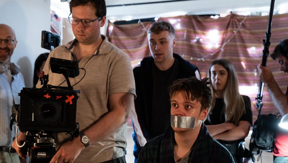 A 2019 BA (Hons) student acting in a LAMDA short film, surrounding by camera and audio equipment