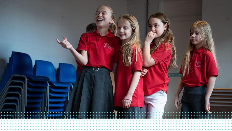 A group of LAMDA learners laughing in rehearsal