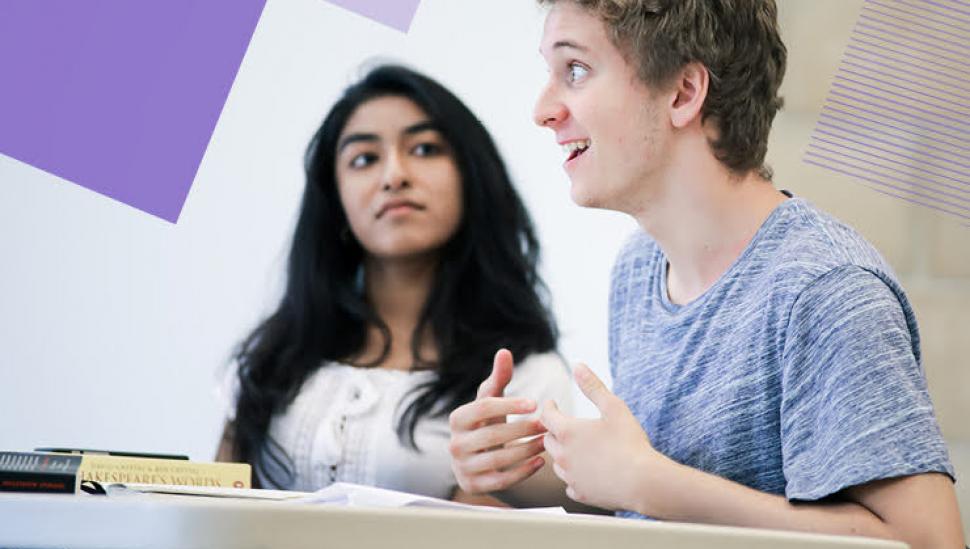 A young man and young woman discuss a script