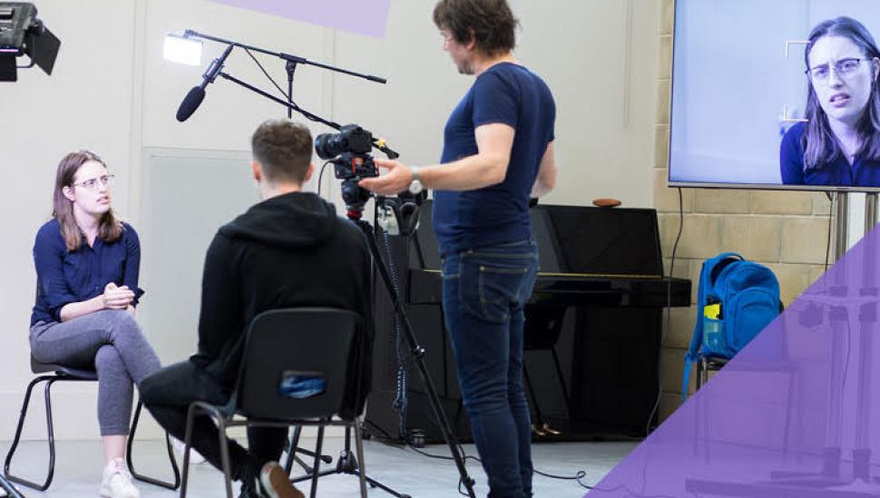 Image of students with a camera