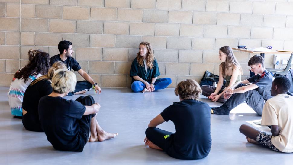 Students on a LAMDA short course sitting in a circle