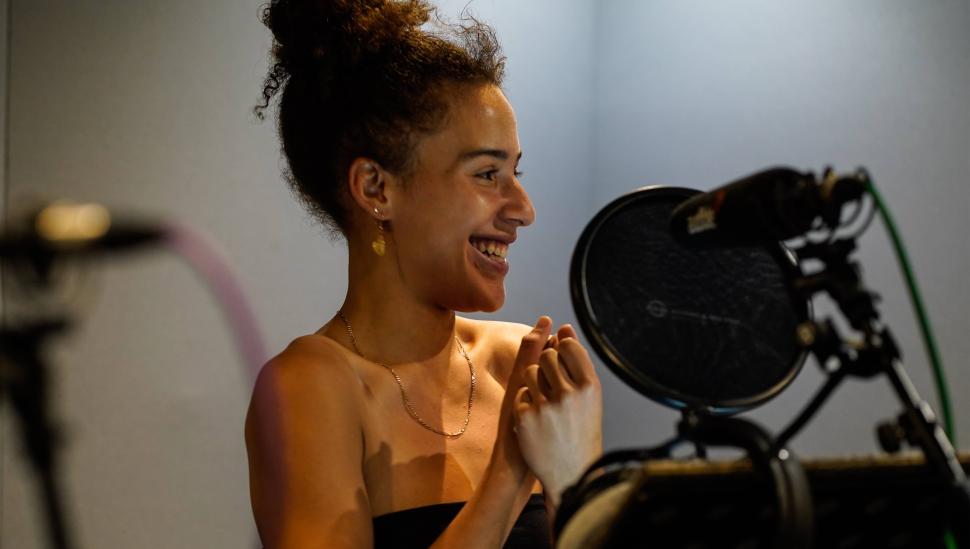 A student in a recording booth