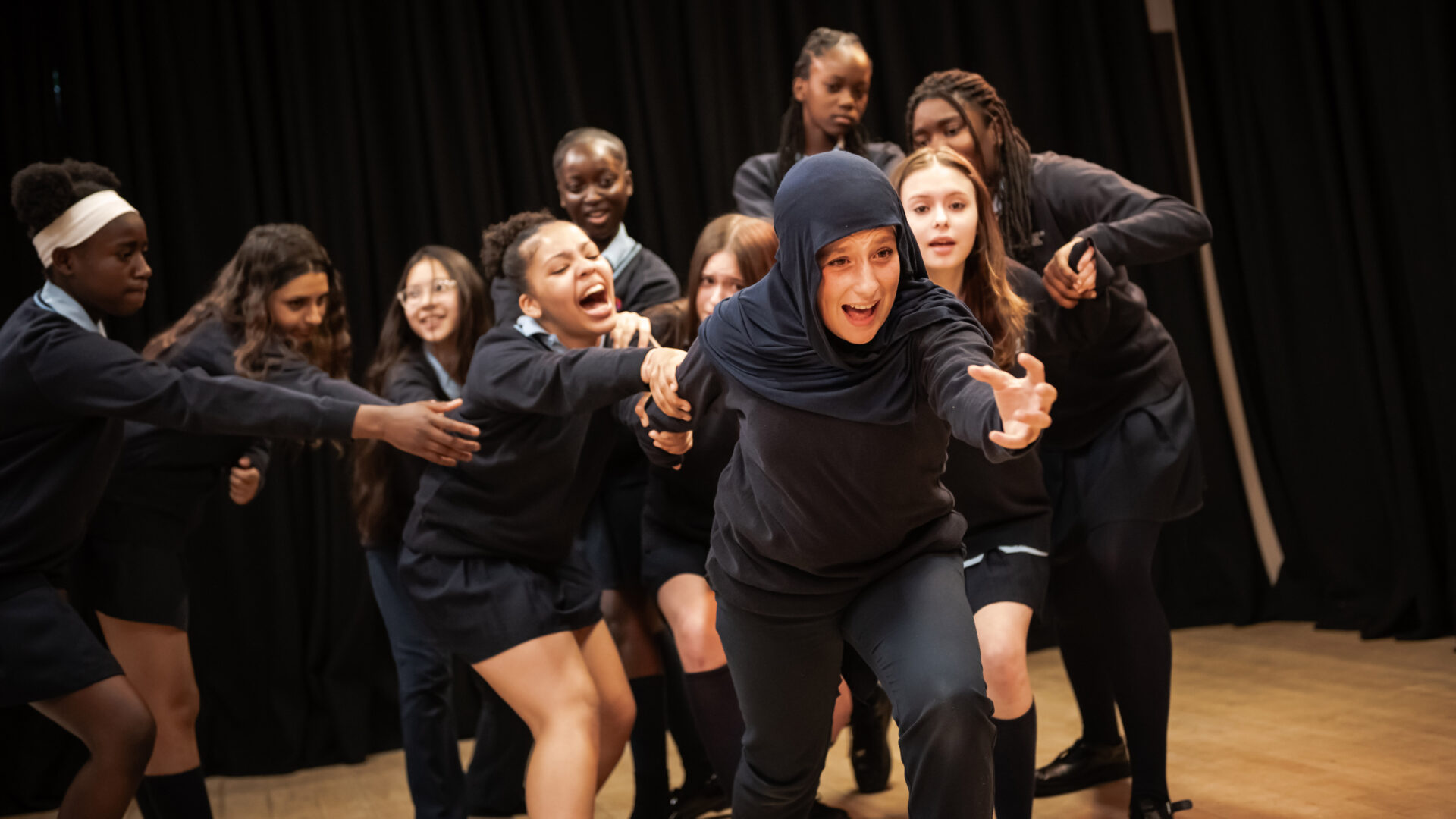 A group of learners perform together