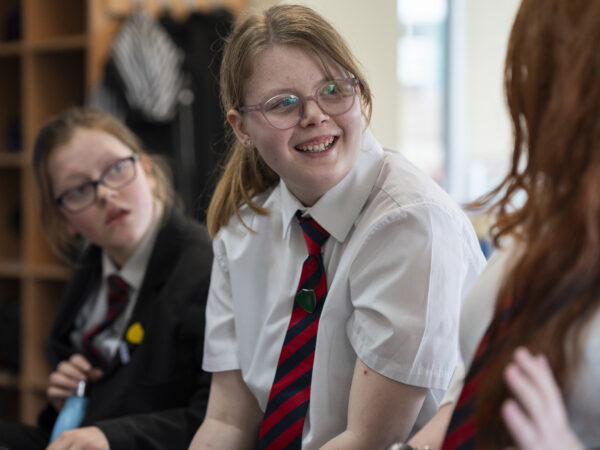 A learner smiles during a lesson