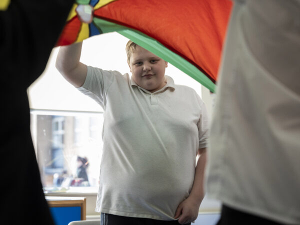A learner taking part in a group activity during a lesson