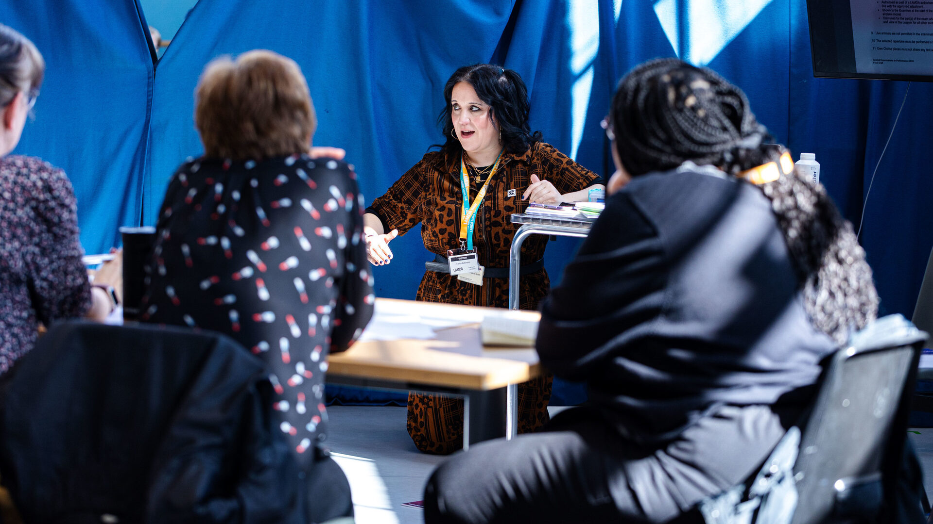 An examiner teaches a course to LAMDA Exams teachers