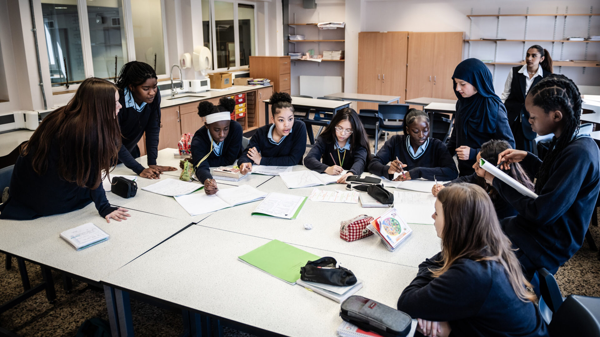 A class work together at their desks