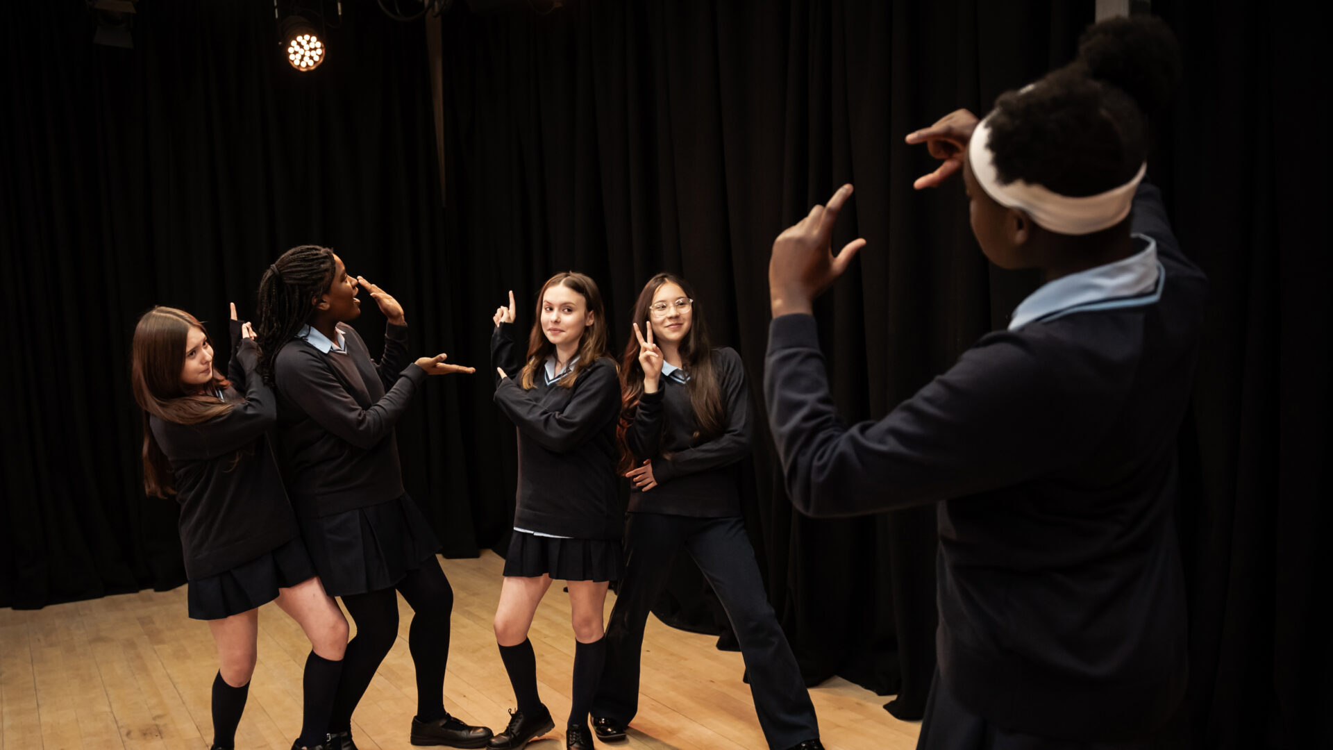 A group of learners created a posed scene during a lesson