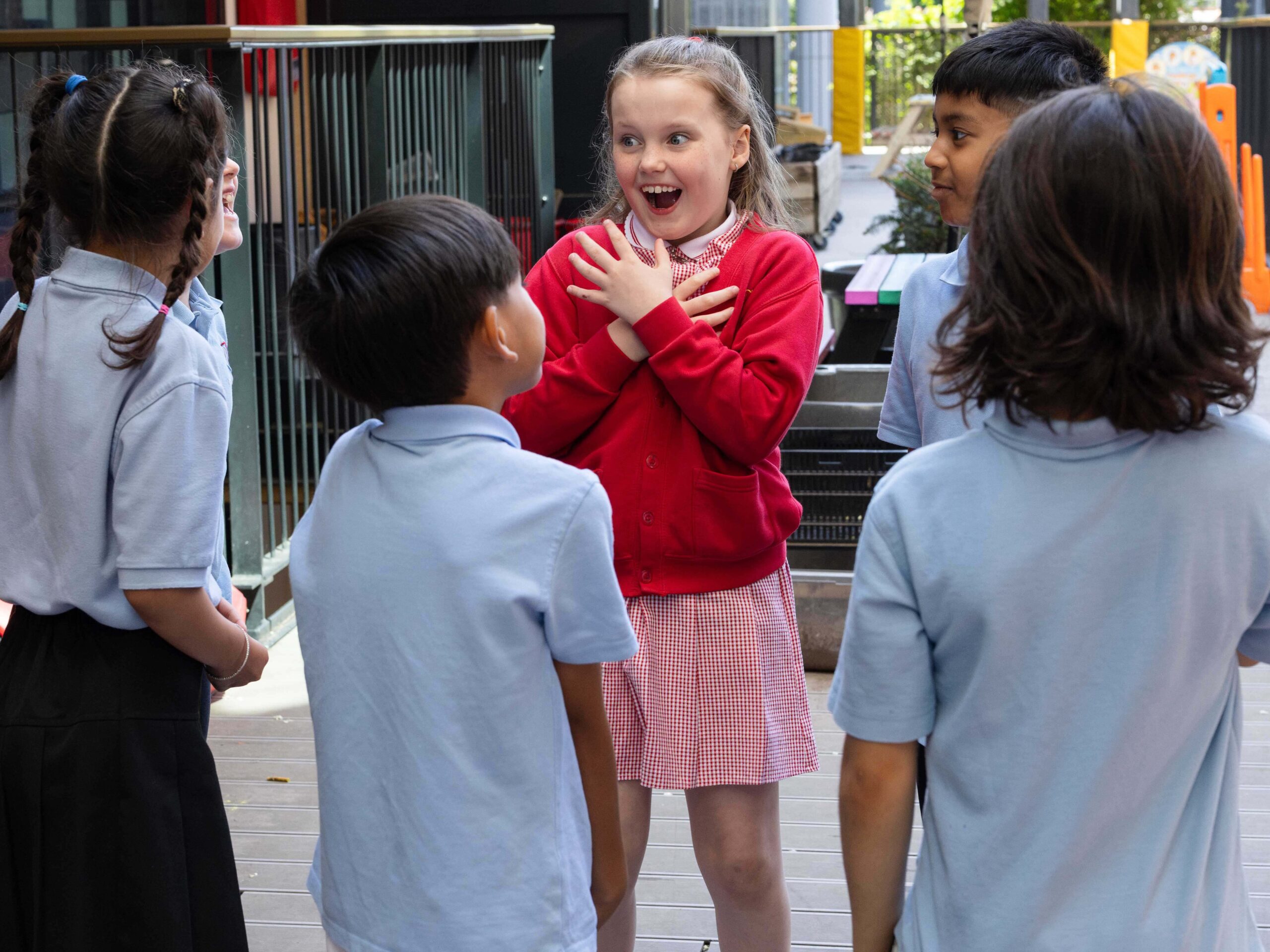Six learners stand in a group