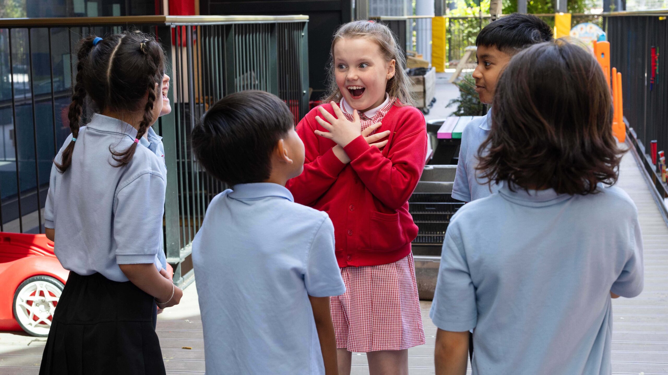 Six learners stand in a group