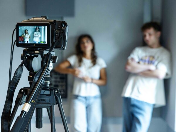 A screen acting class, with a camera pointing at two students in the background